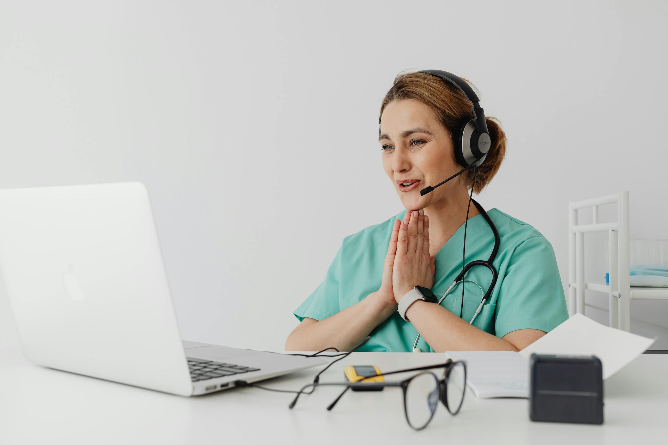 Doctor Using a Laptop to See a Patient